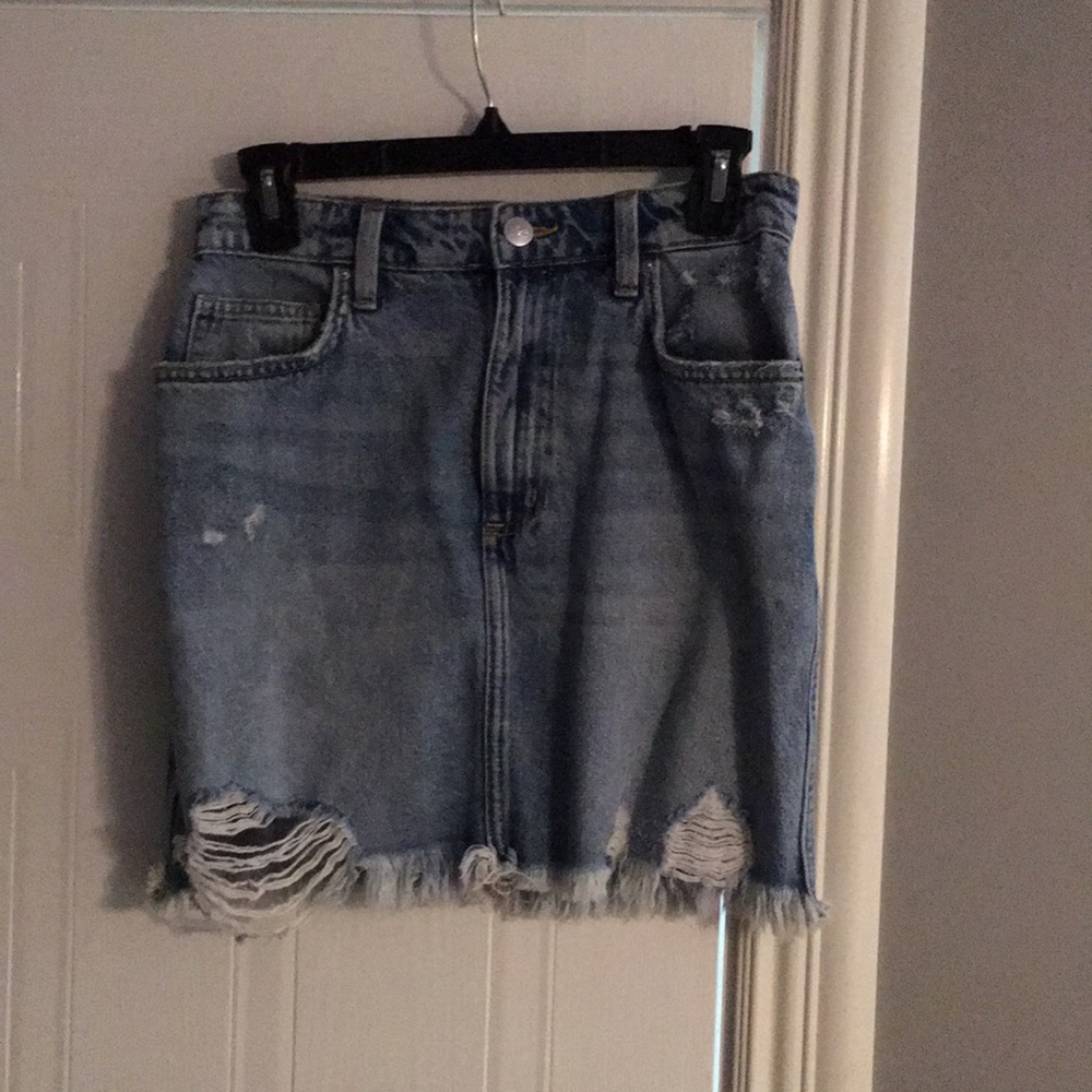 Distressed denim mini skirt
